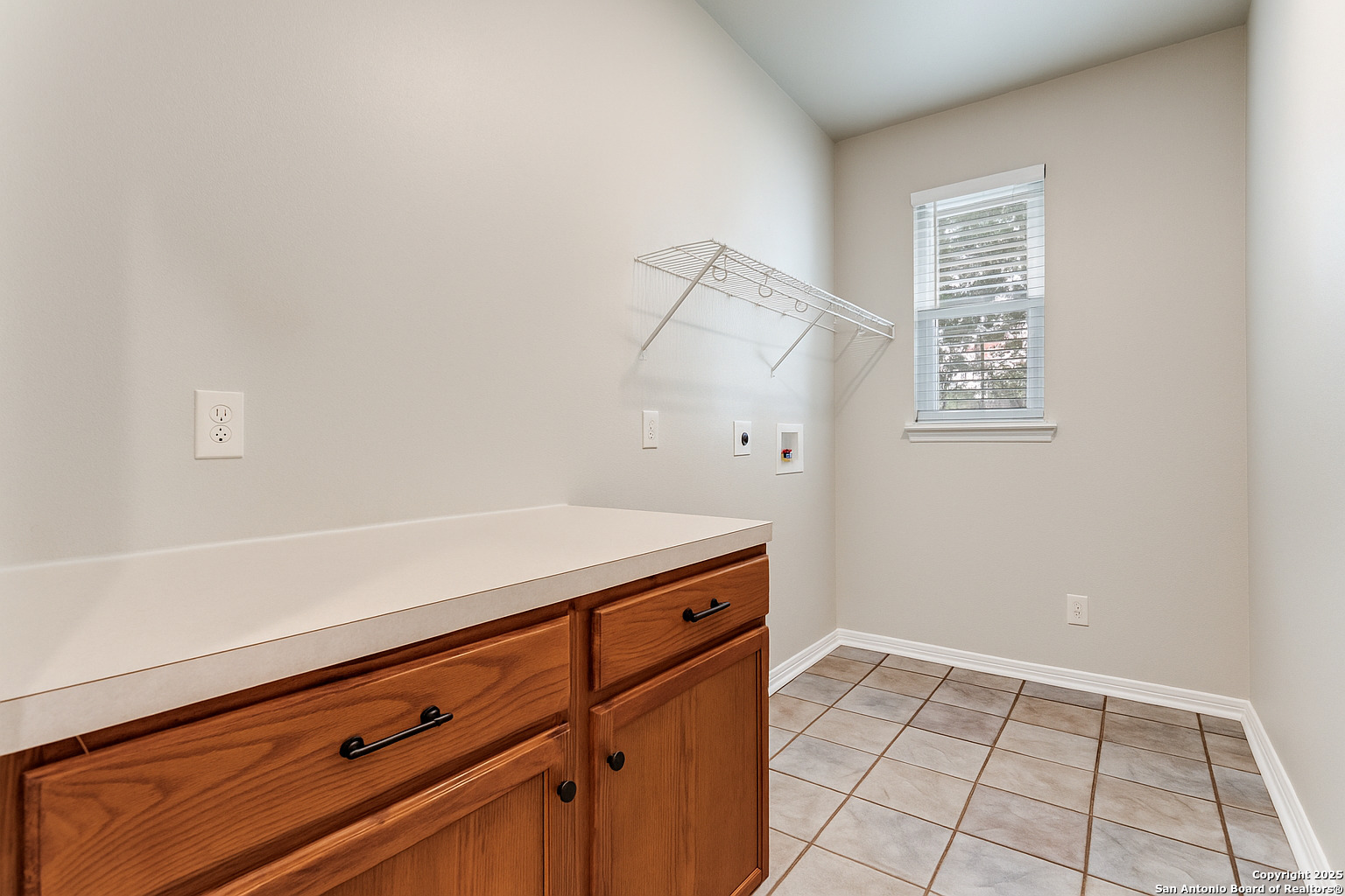 112 Spring Fawn Cibolo, TX 78108 - Photo 24 of 26 a view of a storage and utility room with wooden floor