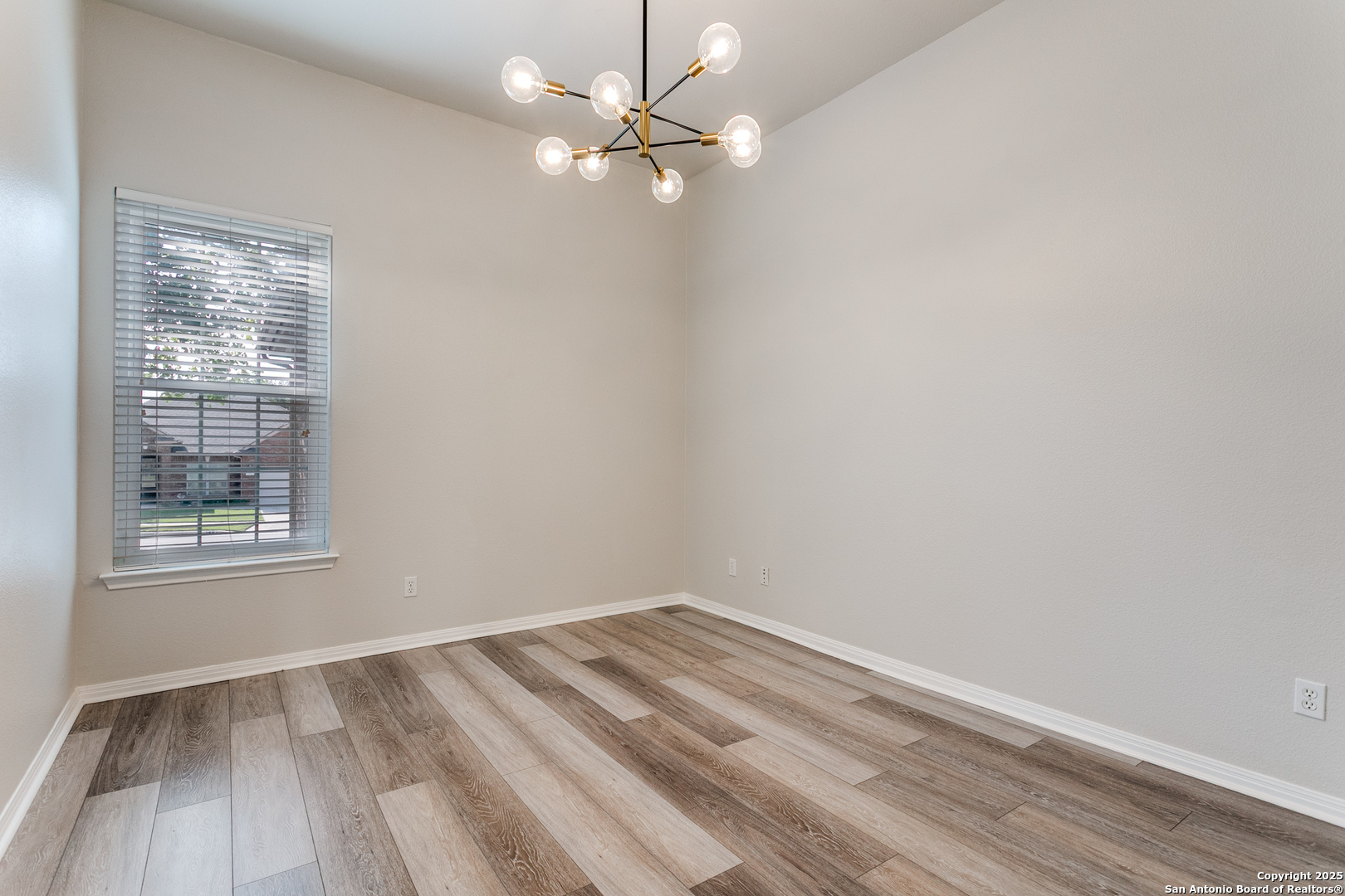 112 Spring Fawn Cibolo, TX 78108 - Photo 8 of 26 an empty room with a window and a fan