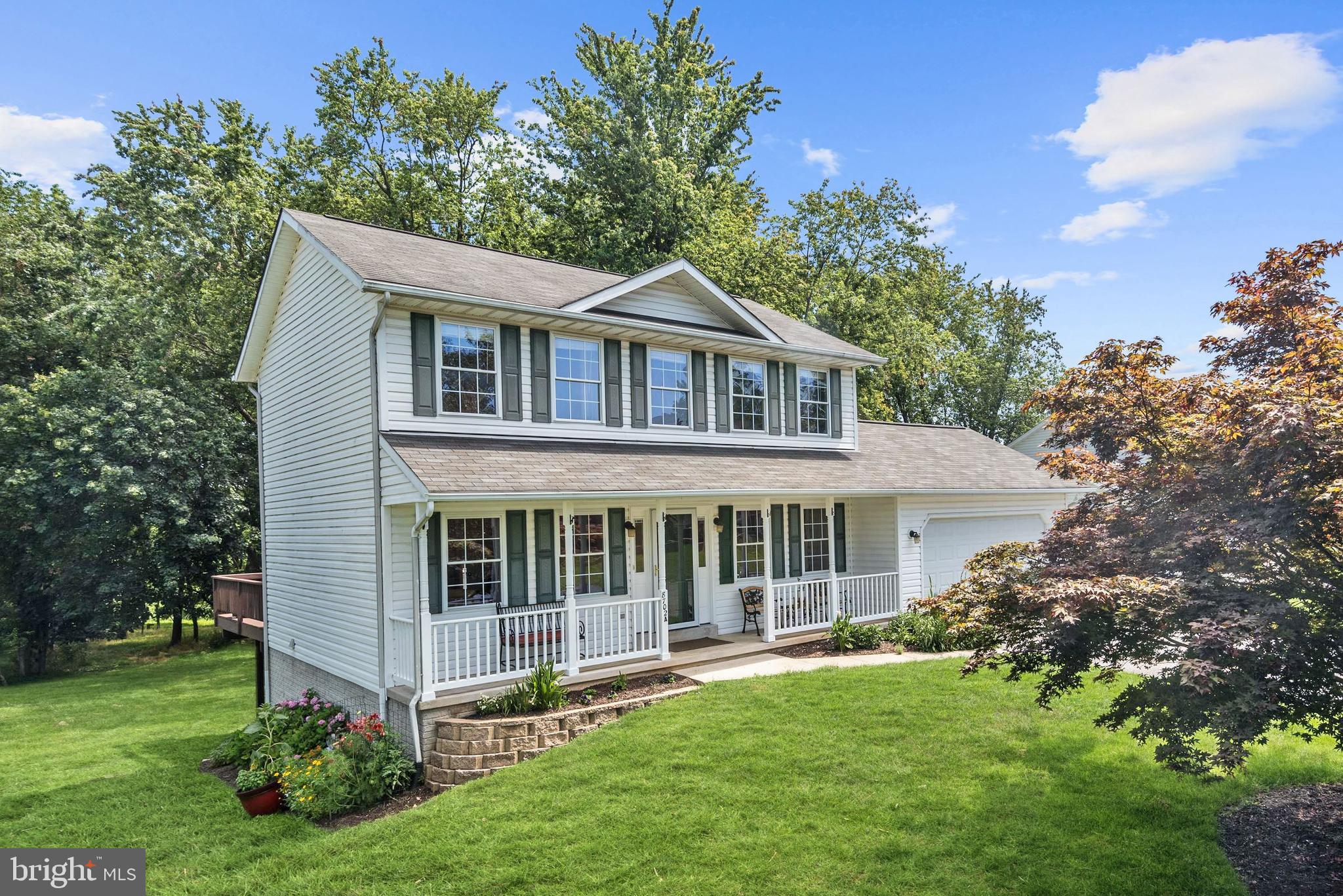 8702 Winands Road Randallstown, MD 21133 - Photo 1 of 32 a front view of a house with a garden