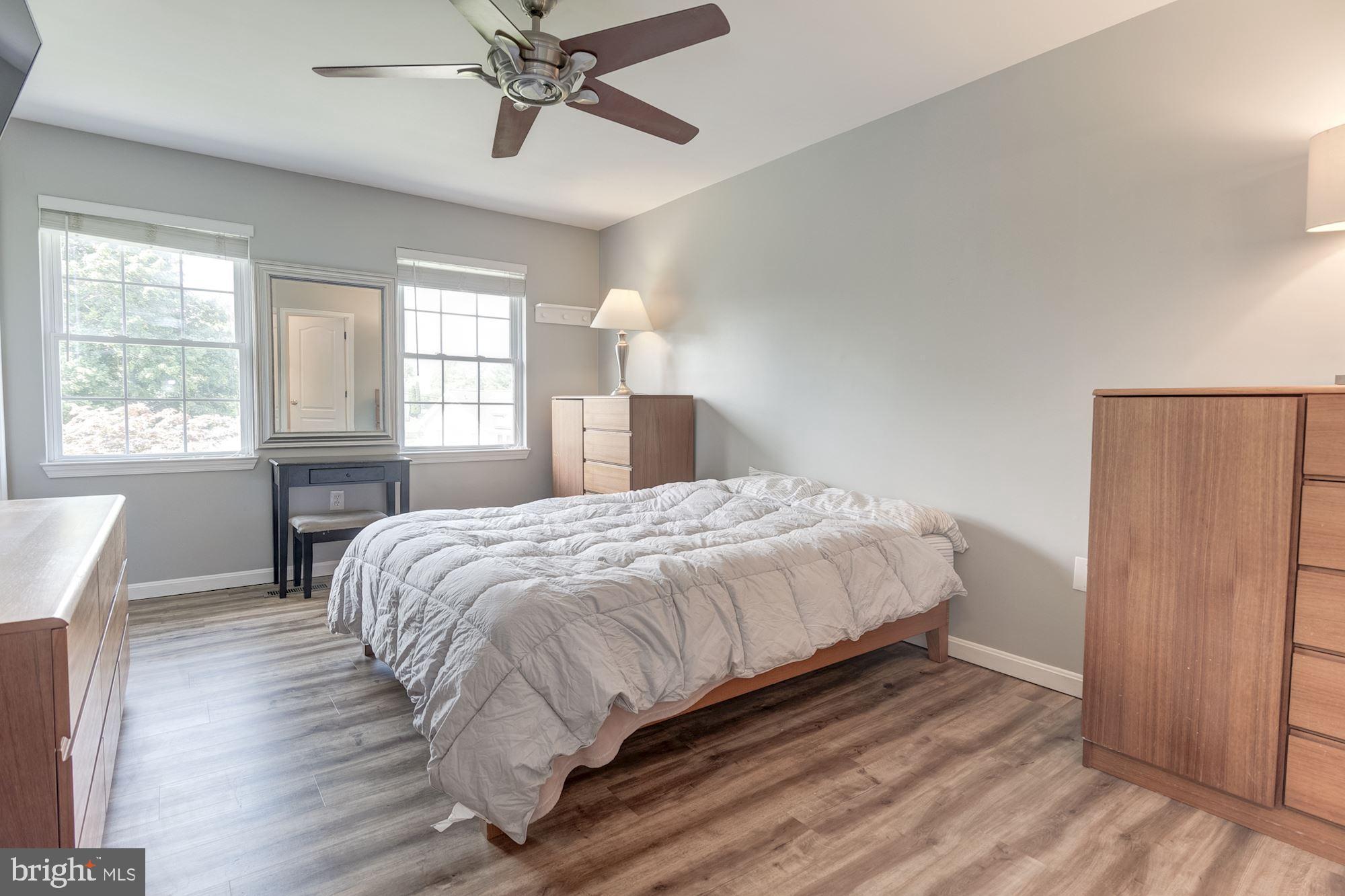 8702 Winands Road Randallstown, MD 21133 - Photo 13 of 32 a bed sitting in a spacious bedroom next to a window