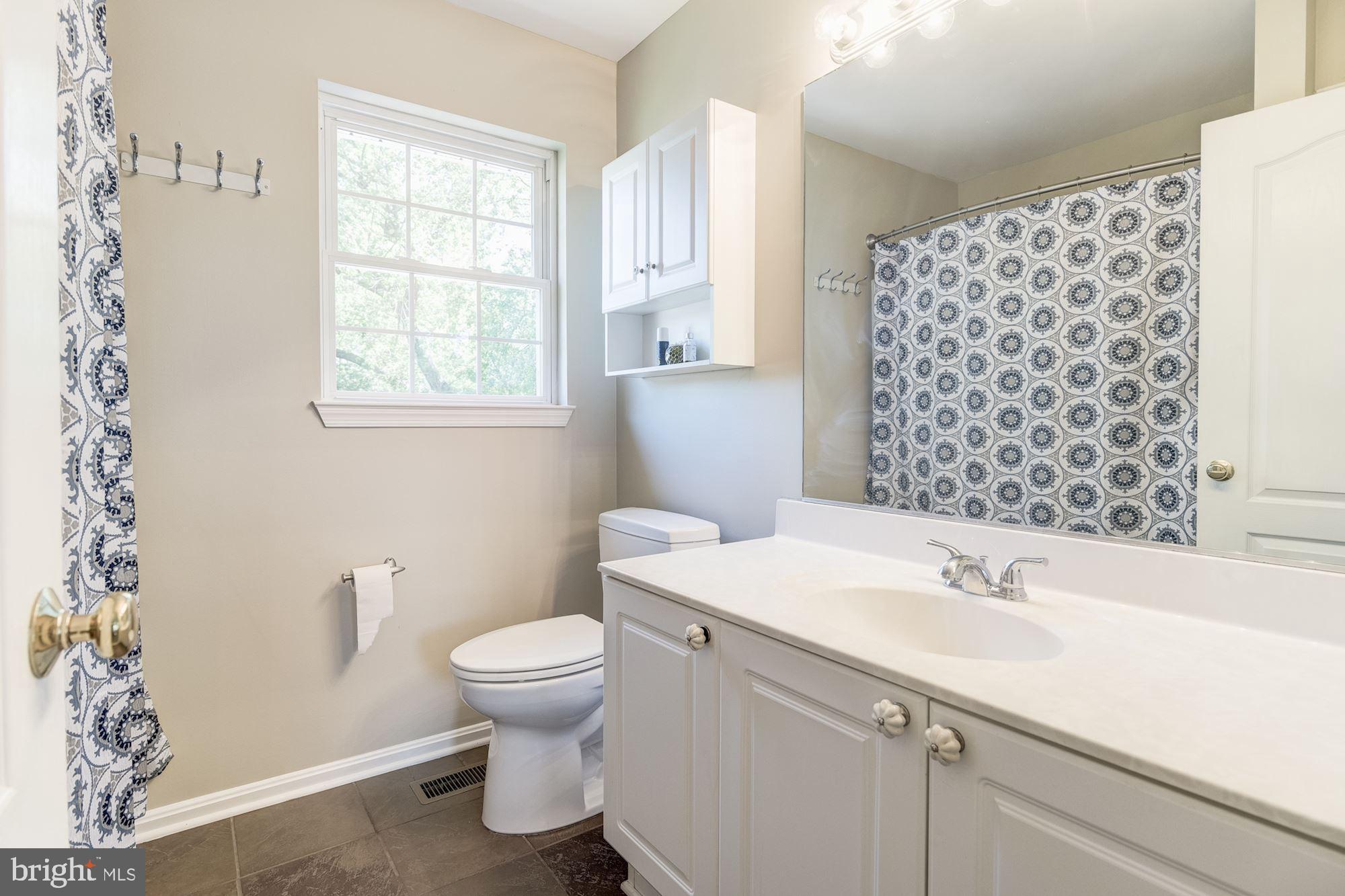8702 Winands Road Randallstown, MD 21133 - Photo 16 of 32 a bathroom with a sink toilet and shower