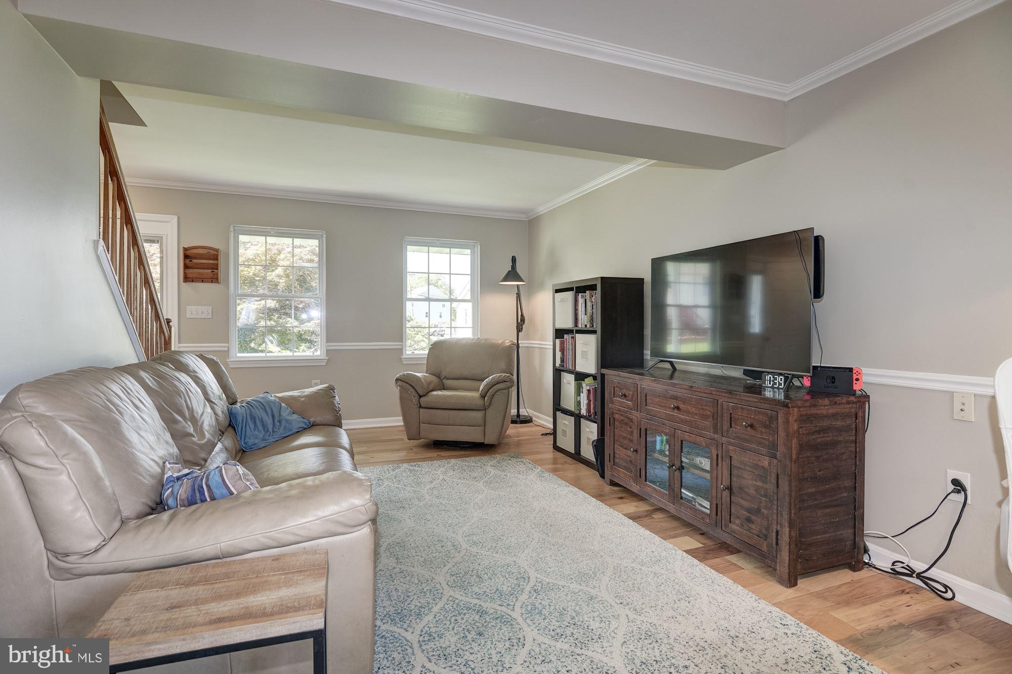 8702 Winands Road Randallstown, MD 21133 - Photo 3 of 32 a living room with furniture and a flat screen tv