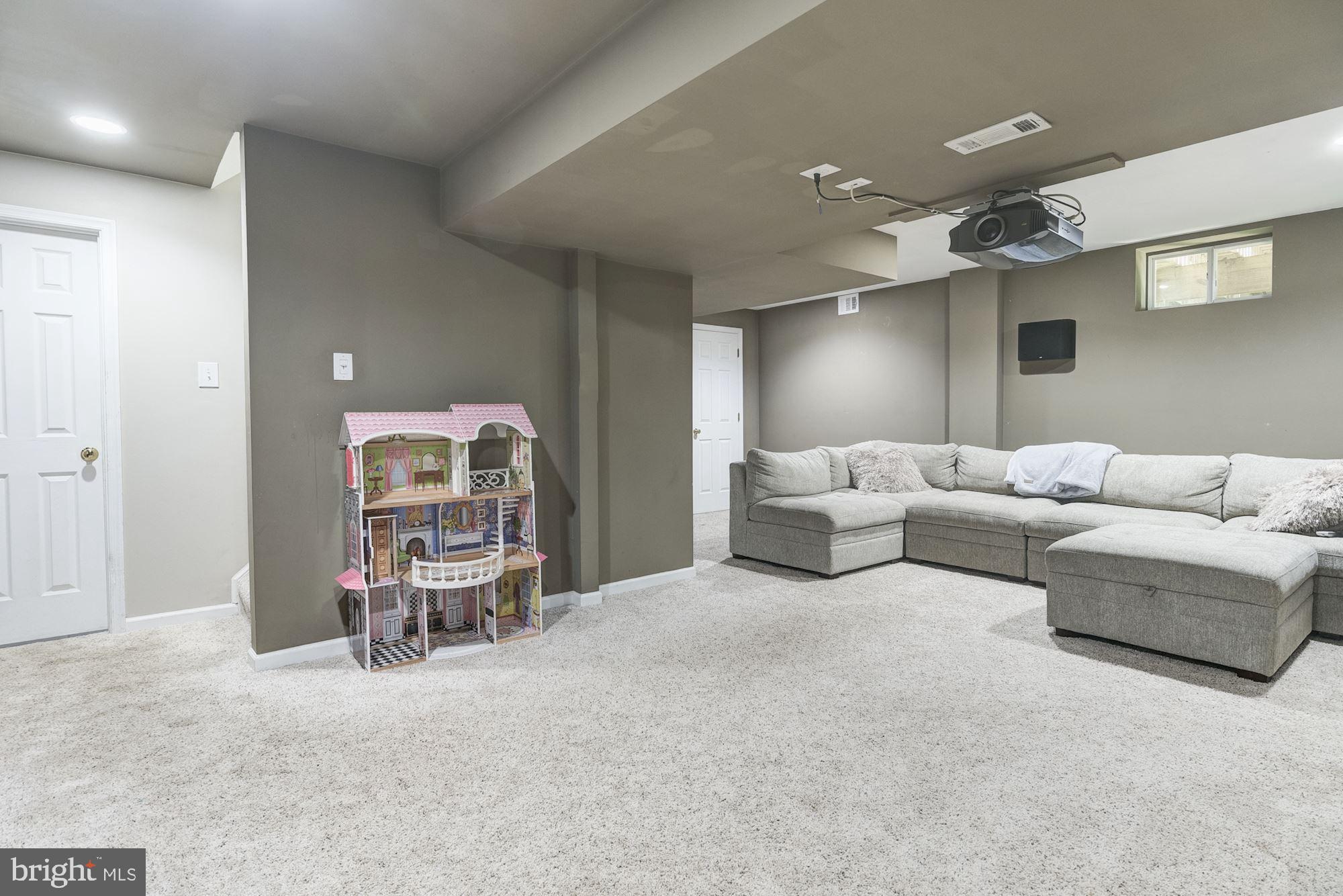 8702 Winands Road Randallstown, MD 21133 - Photo 21 of 32 a living room with furniture and a chair