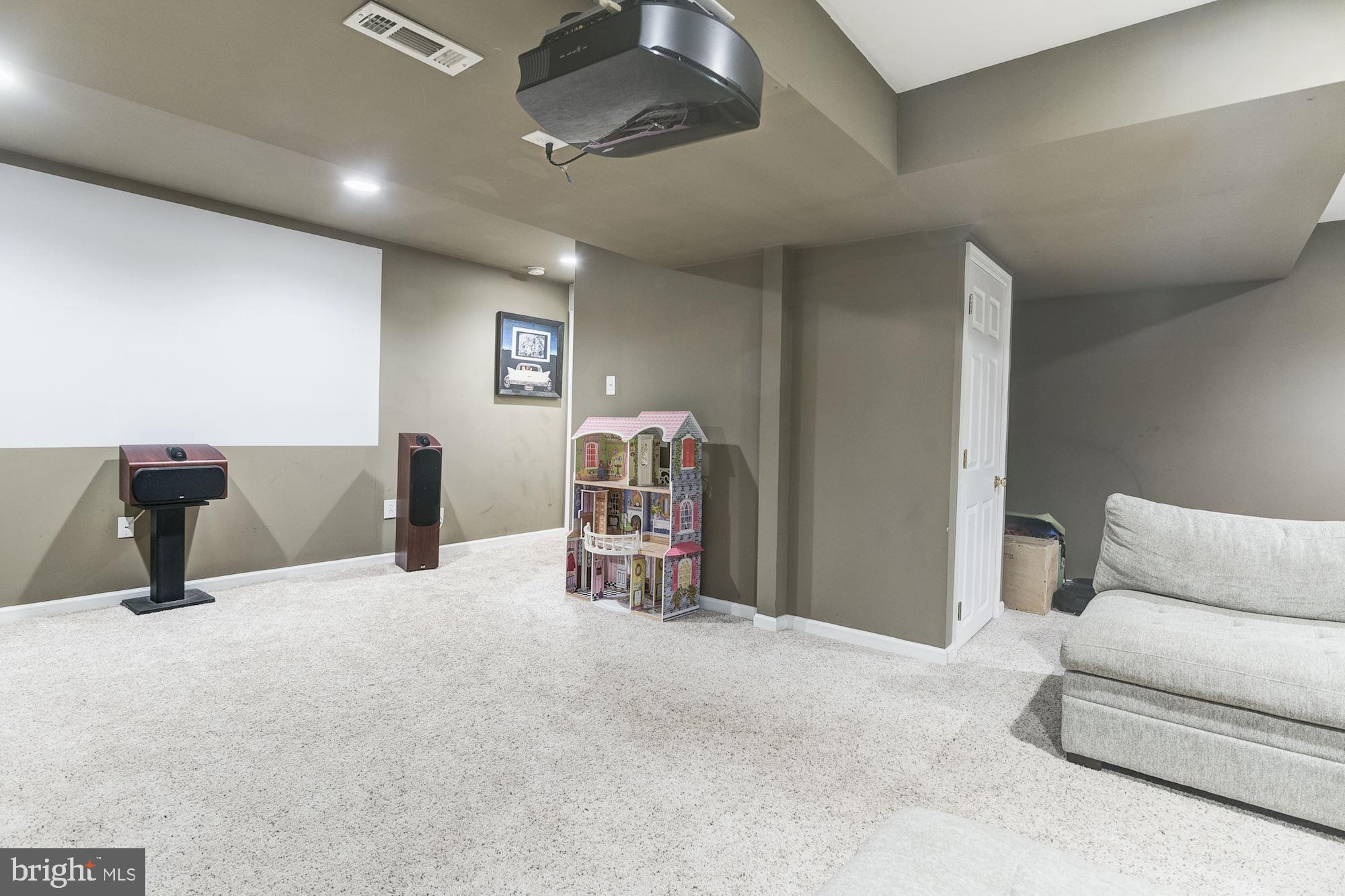 8702 Winands Road Randallstown, MD 21133 - Photo 22 of 32 a bedroom with a bed and a couch