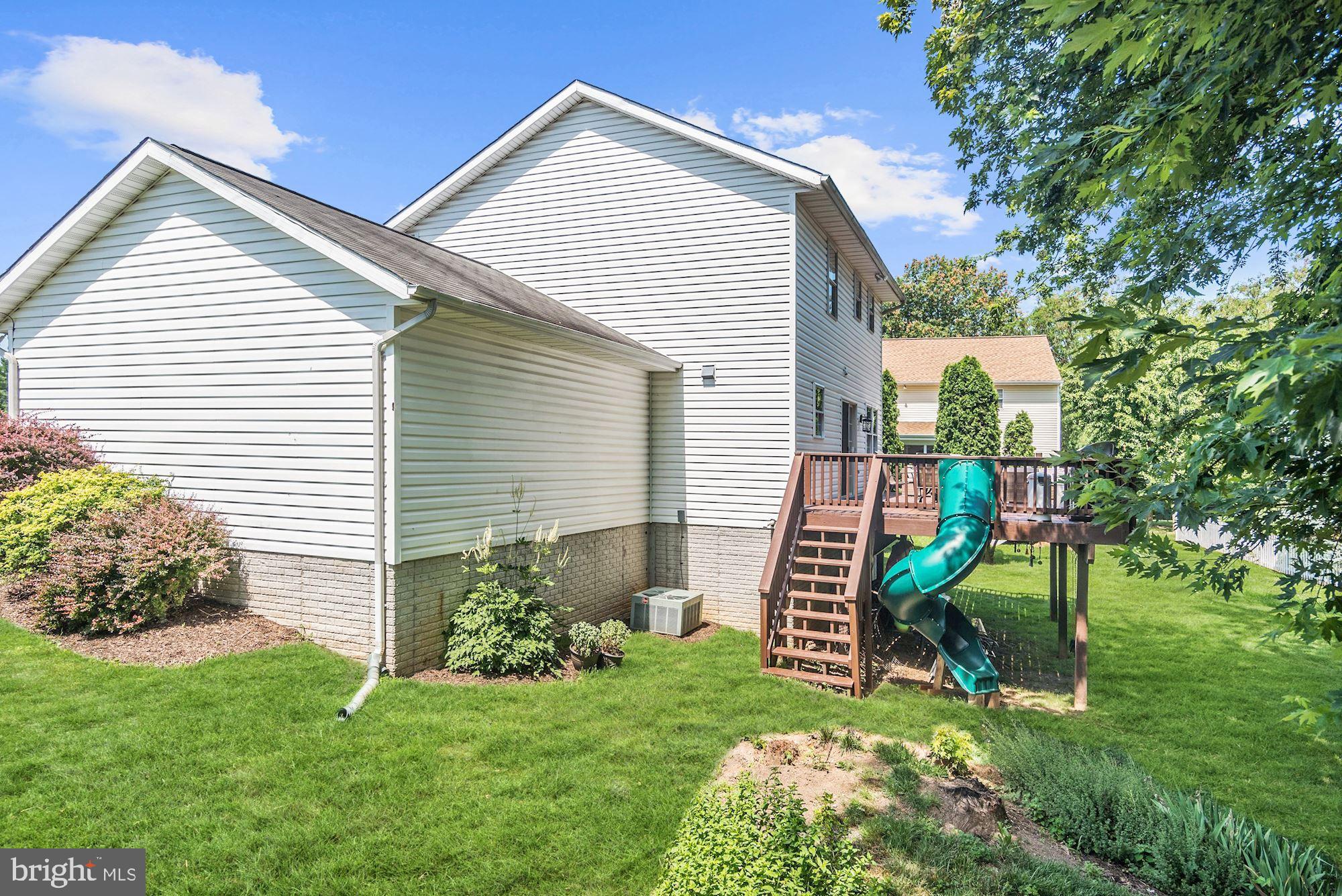 8702 Winands Road Randallstown, MD 21133 - Photo 26 of 32 a front view of a house with a yard