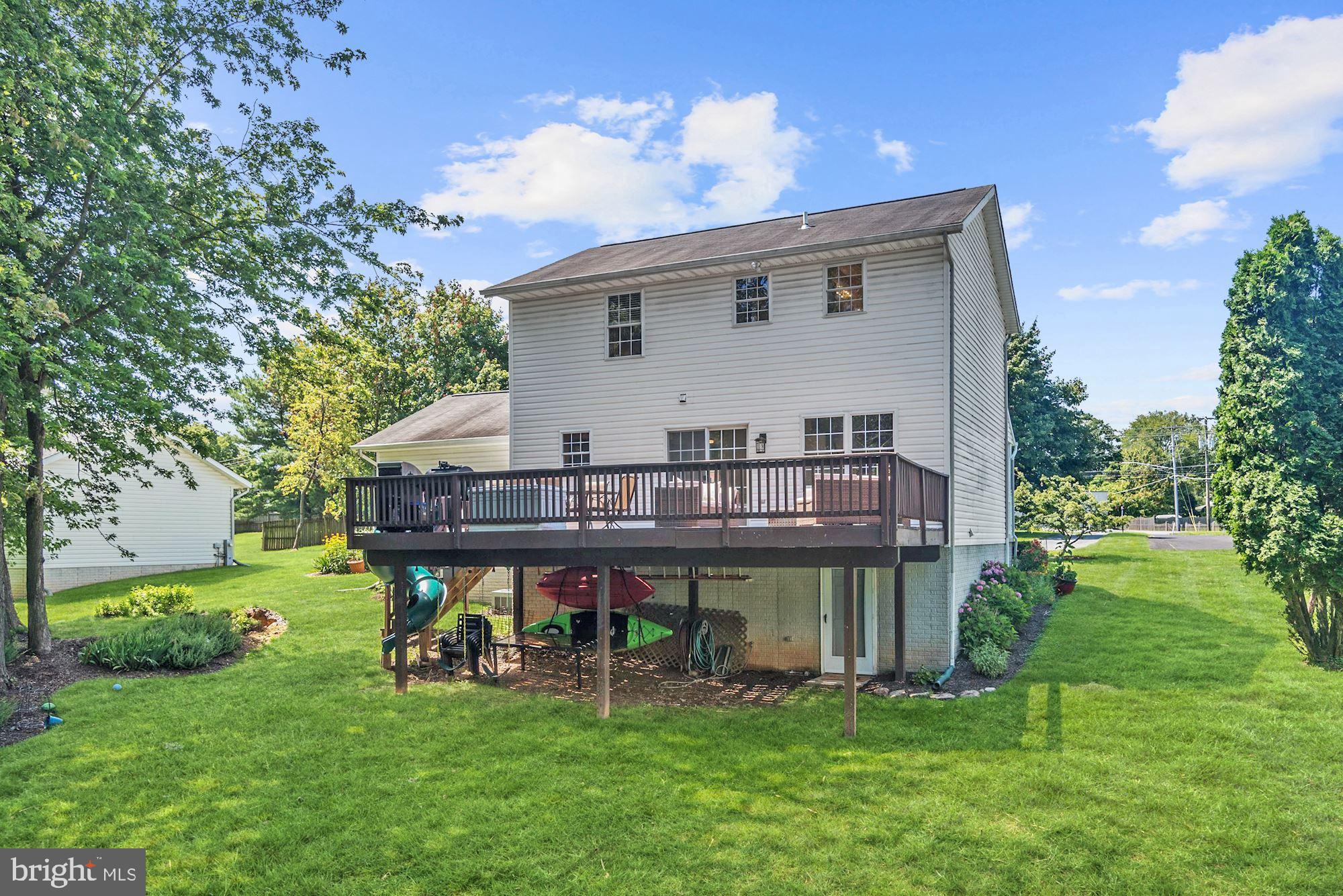 8702 Winands Road Randallstown, MD 21133 - Photo 28 of 32 a view of a house with a backyard and sitting area
