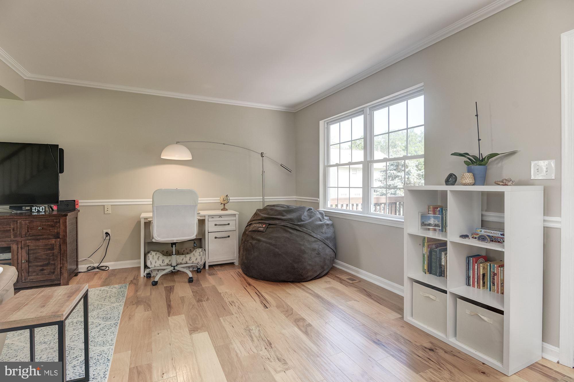 8702 Winands Road Randallstown, MD 21133 - Photo 5 of 32 a room with furniture and a flat screen tv