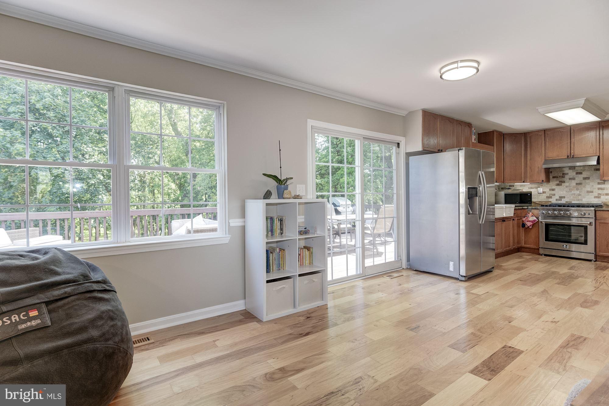 8702 Winands Road Randallstown, MD 21133 - Photo 6 of 32 a kitchen with stainless steel appliances a refrigerator and a stove