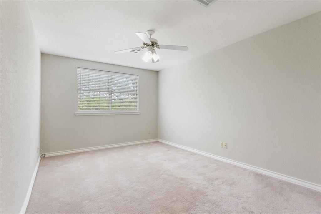 4843 South 3rd St Road Waco, TX 76706 - Photo 25 of 39 Spare room featuring baseboards, carpet floors, and ceiling fan