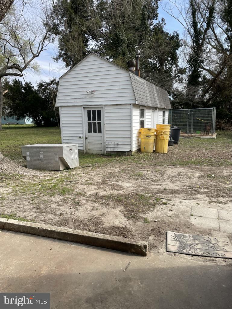 305 North Main Street Hurlock, MD 21643 - Photo 17 of 20 a front view of a house with a yard