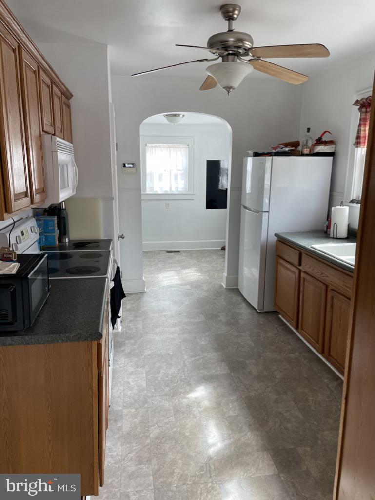 305 North Main Street Hurlock, MD 21643 - Photo 4 of 20 a kitchen that has a microwave and a sink