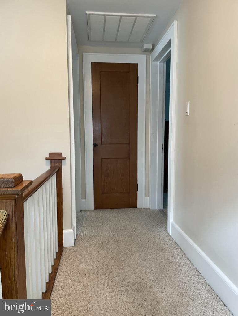 305 North Main Street Hurlock, MD 21643 - Photo 10 of 20 a view of a hallway with wooden floor and entryway
