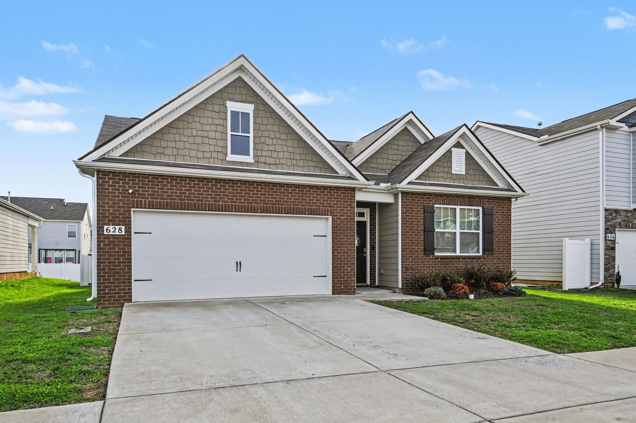 628 Pine Bloom Road Lebanon, TN 37087 - Photo 3 of 25 a front view of a house with a yard and garage
