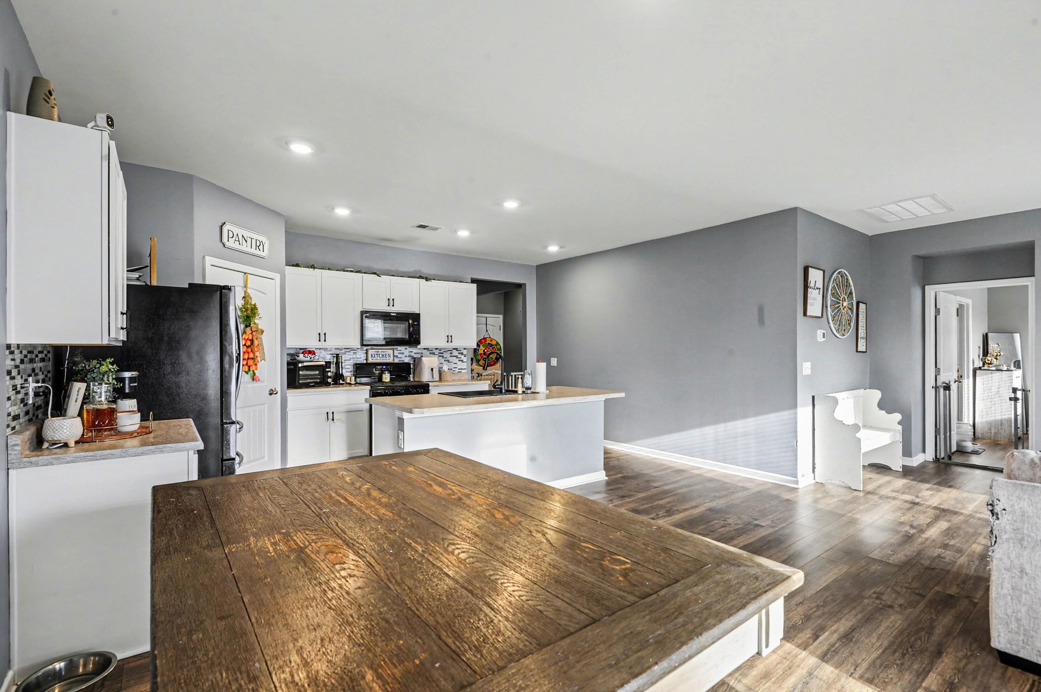 628 Pine Bloom Road Lebanon, TN 37087 - Photo 6 of 25 a kitchen with stainless steel appliances kitchen island granite countertop a refrigerator and a sink