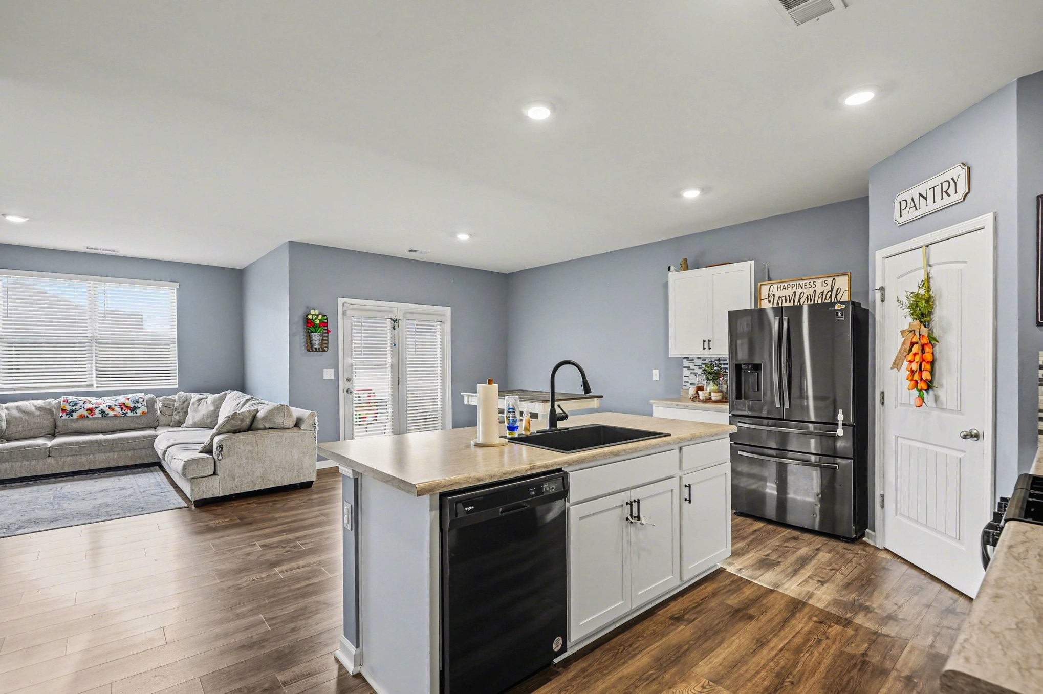 628 Pine Bloom Road Lebanon, TN 37087 - Photo 8 of 25 a kitchen with a refrigerator sink and couches