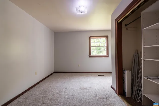a view of a field with an trees