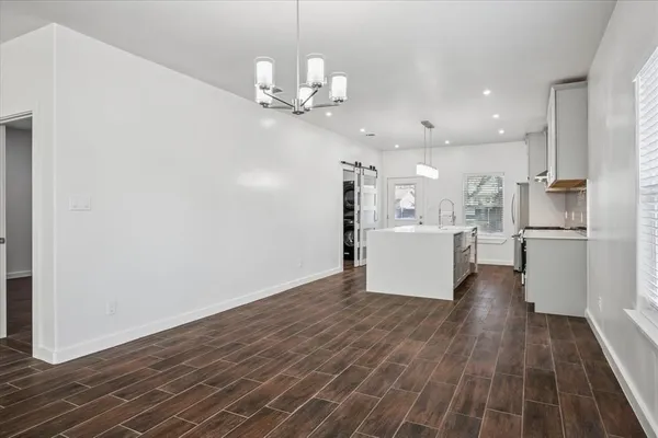 a view of kitchen with cabinets and wooden floor