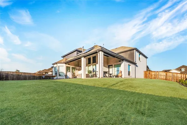 a big house with a big yard and more windows
