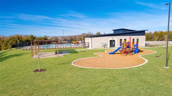 a swimming pool with outdoor seating and yard