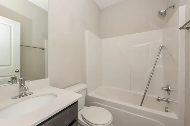 a bathroom with a sink toilet and a bathtub