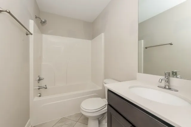 a bathroom with a sink a toilet and a bathtub