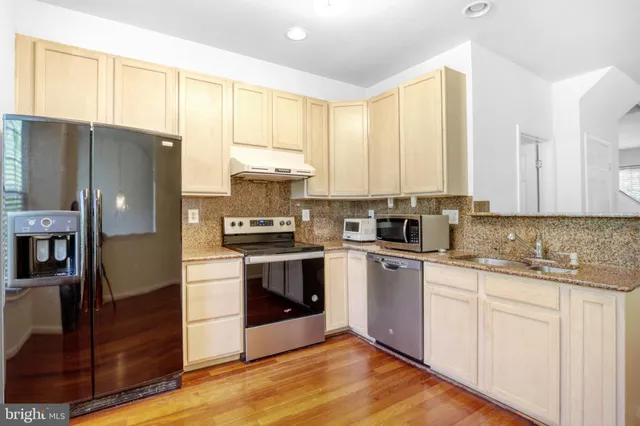 a view of entryway with wooden floor