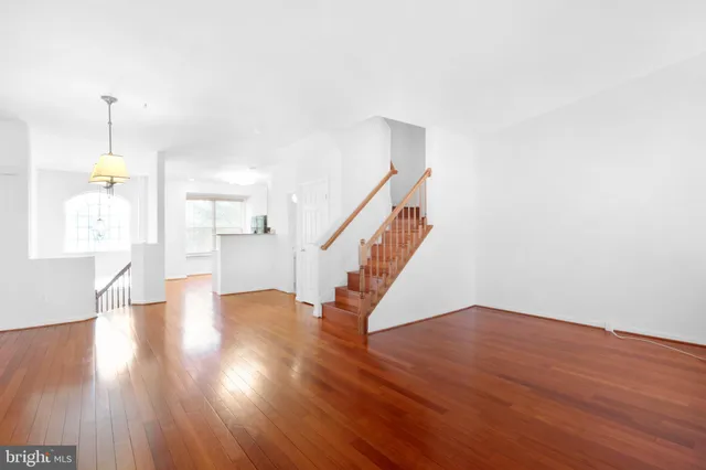 a kitchen with granite countertop a sink cabinets and stainless steel appliances