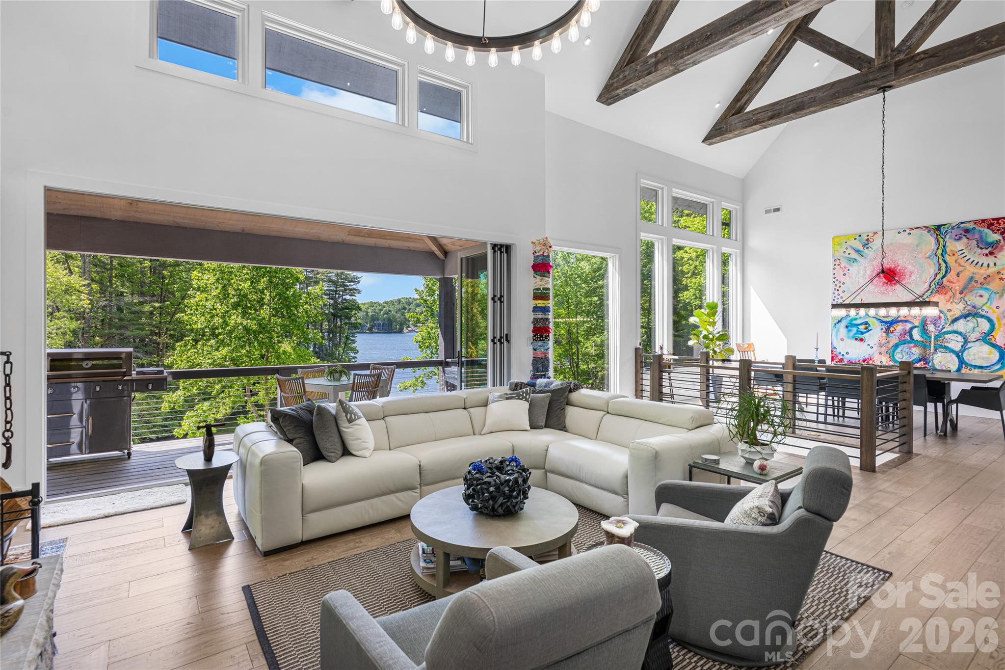 2235 Cold Mountain Road Lake Toxaway, NC 28747 - Photo 5 of 47 a living room with furniture and a floor to ceiling window