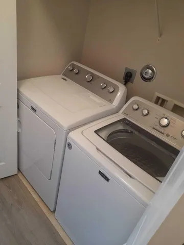 a utility room with dryer and washer