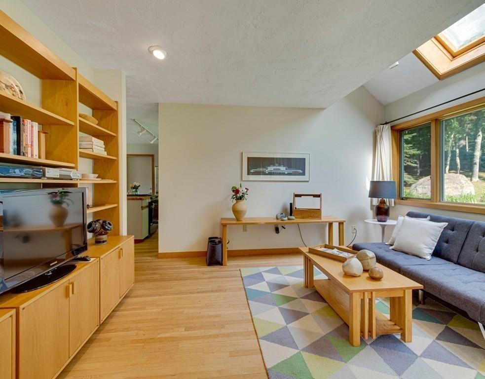 161 Tower Road Lincoln, MA 01773 - Photo 3 of 28 a living room with patio furniture and a flat screen tv