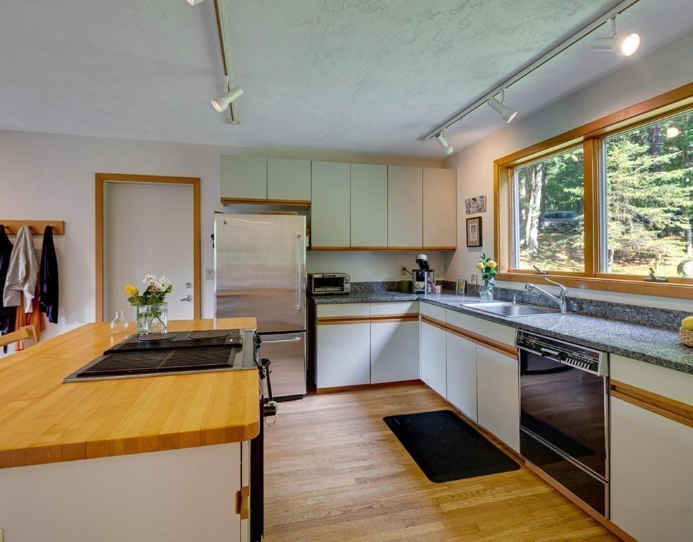 161 Tower Road Lincoln, MA 01773 - Photo 7 of 28 a kitchen with a sink stove and refrigerator