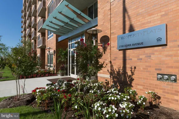 a view of a pathway along the house