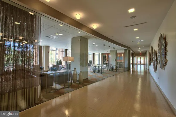 a lobby with furniture and floor to ceiling window
