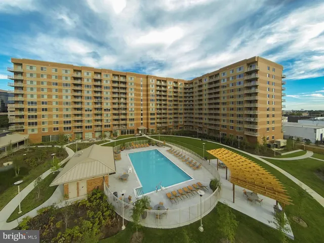 a view of swimming pool from a balcony