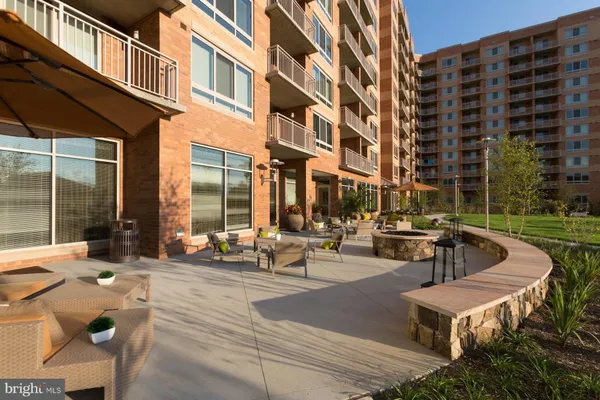 a building outdoor space with patio furniture and a patio