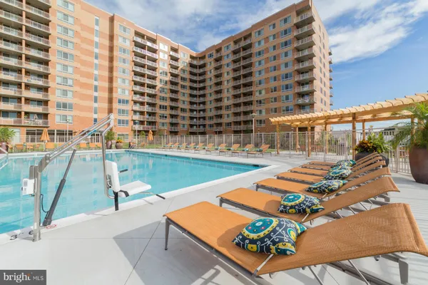 a view of swimming pool with outdoor seating