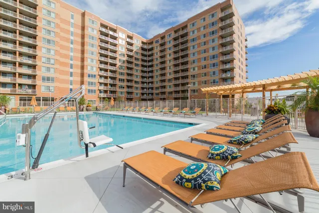 a view of swimming pool with outdoor seating