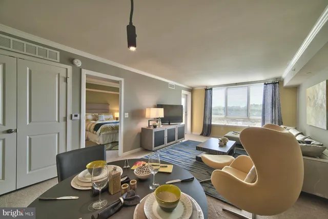 a living room with furniture and a table