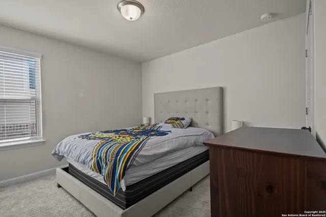 a bathroom with a toilet a sink and a mirror