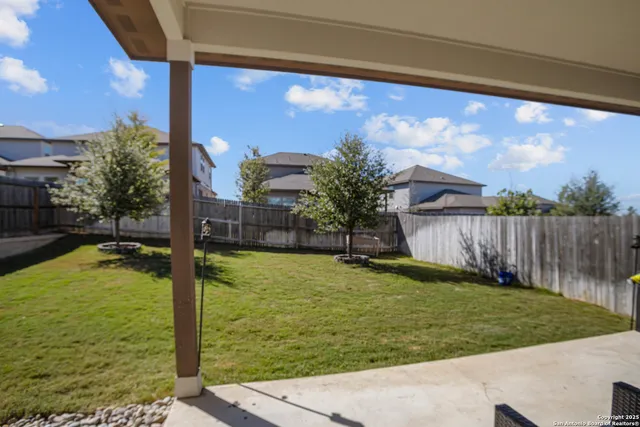 a front view of a house with swimming pool having outdoor seating