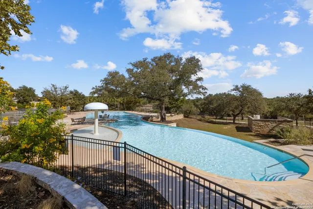 a view of house with yard and sitting area