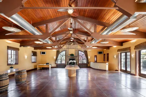 a view of a room with wooden floors