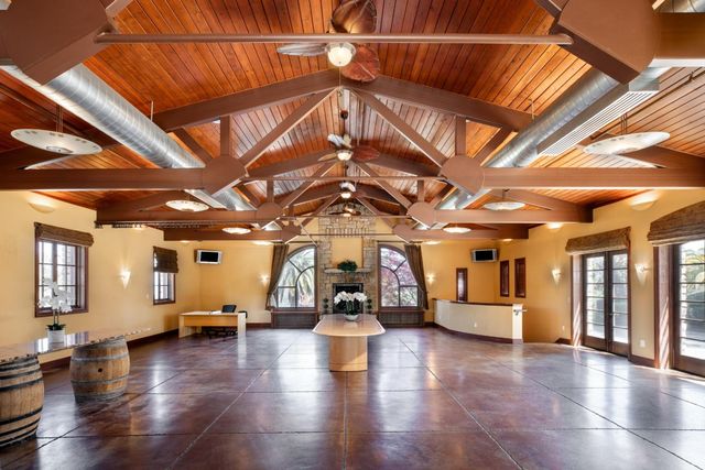 a view of a room with wooden floors