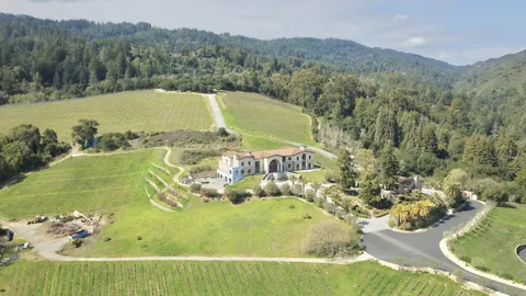 a view of a swimming pool with a yard