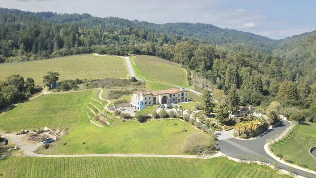 a view of a swimming pool with a yard