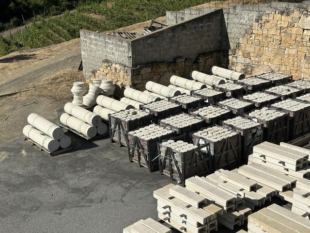 a view of a house with a wooden fence