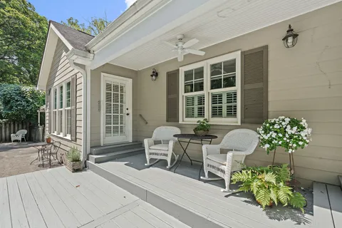 a view of a patio with chairs and a table