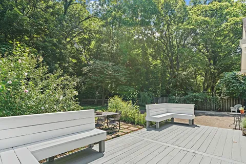 a view of a bench in a backyard