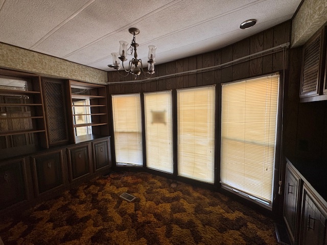 135 Avenue C Bloomington, IL 61704 - Photo 11 of 15 a view of a livingroom with an empty space and a window
