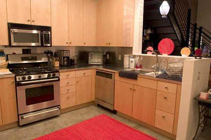 914 East Osborn Road, Unit 209 Phoenix, AZ 85014 - Photo 2 of 5 a kitchen with stainless steel appliances granite countertop a stove a sink and a microwave